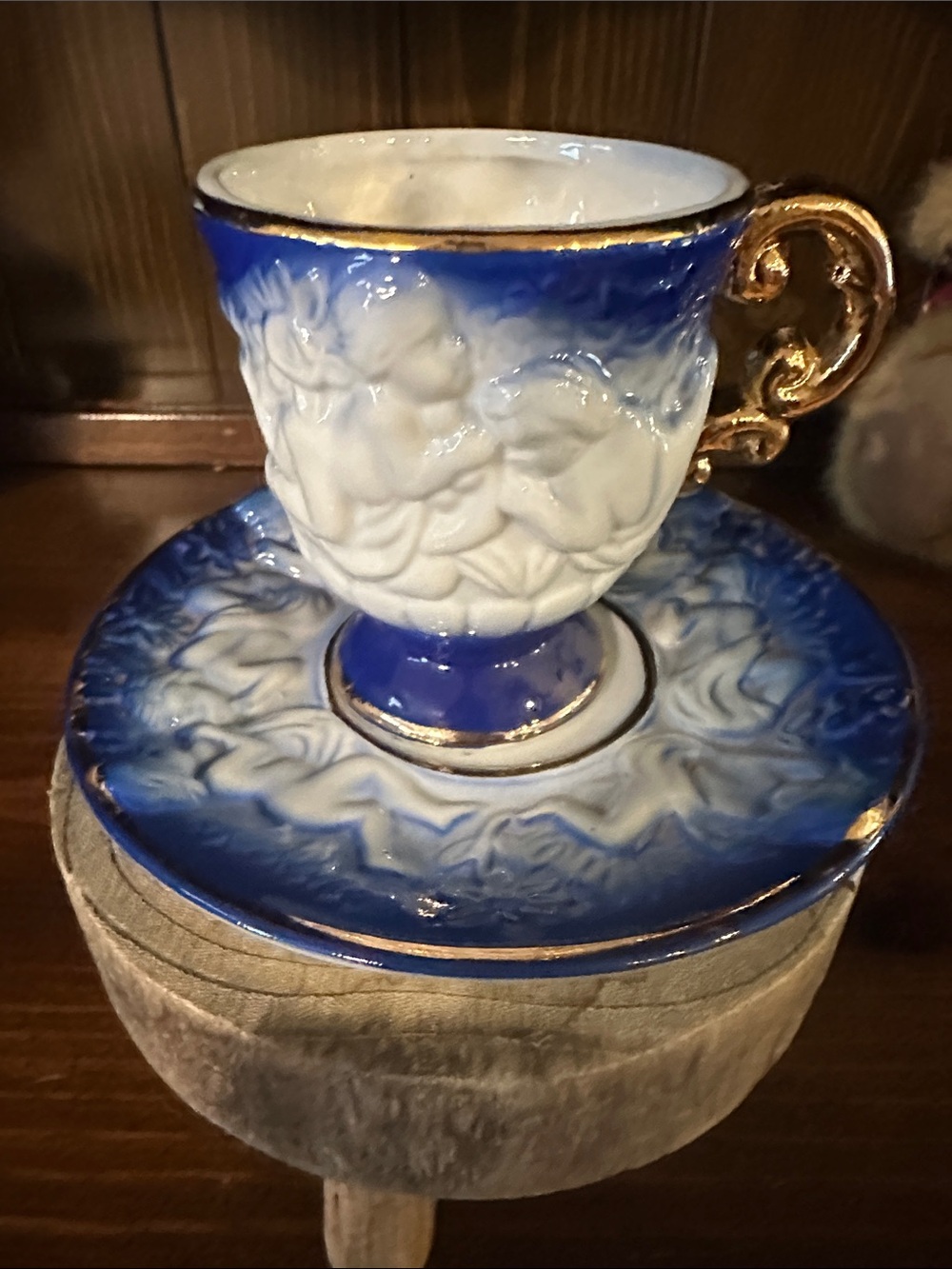 Ornate Blue and Gold Cherub tea cup and saucer